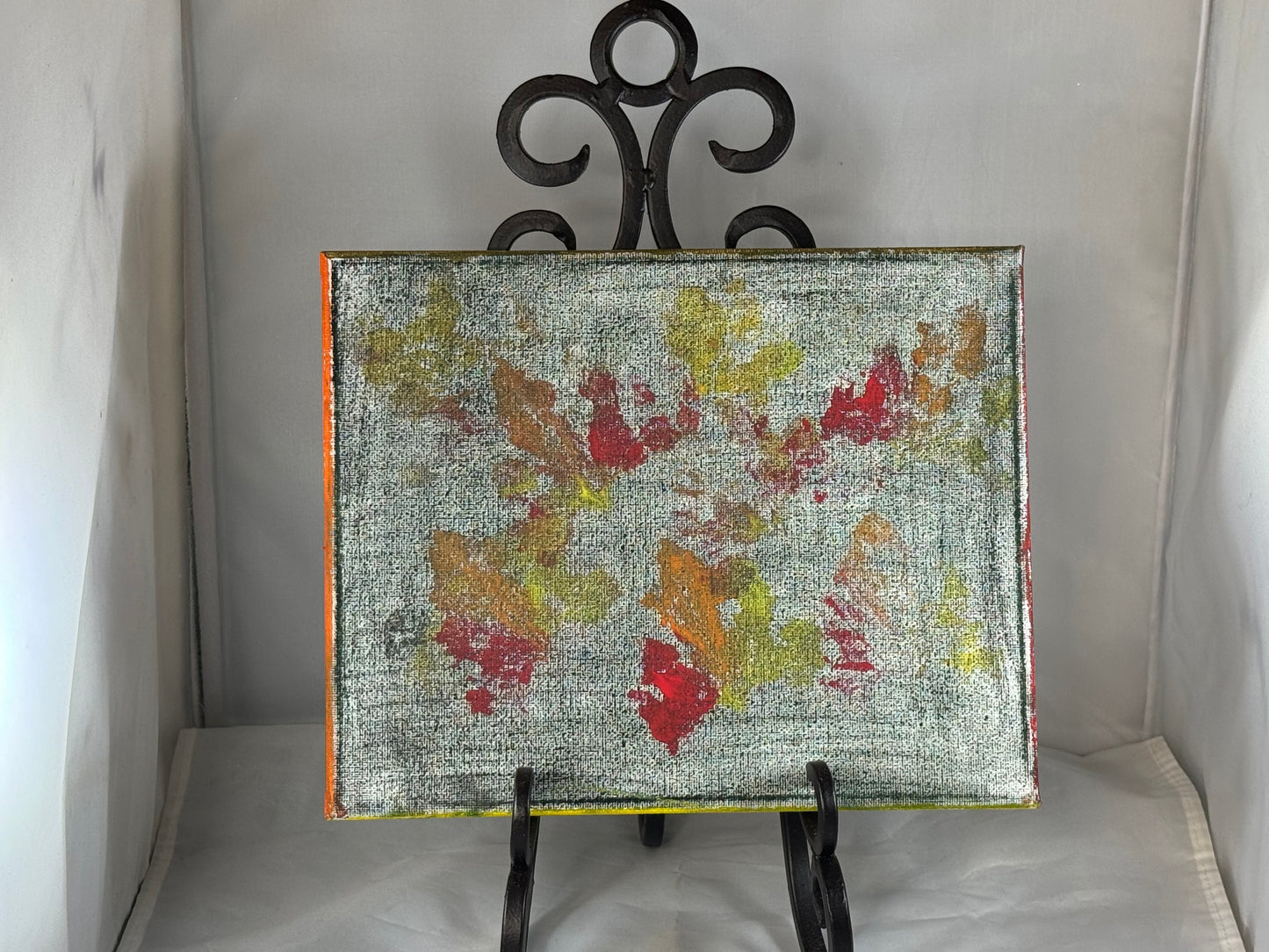 Kid art for sale to help those in need. Pictured "Leaf Stamp" (Canvas, 8" x 10")