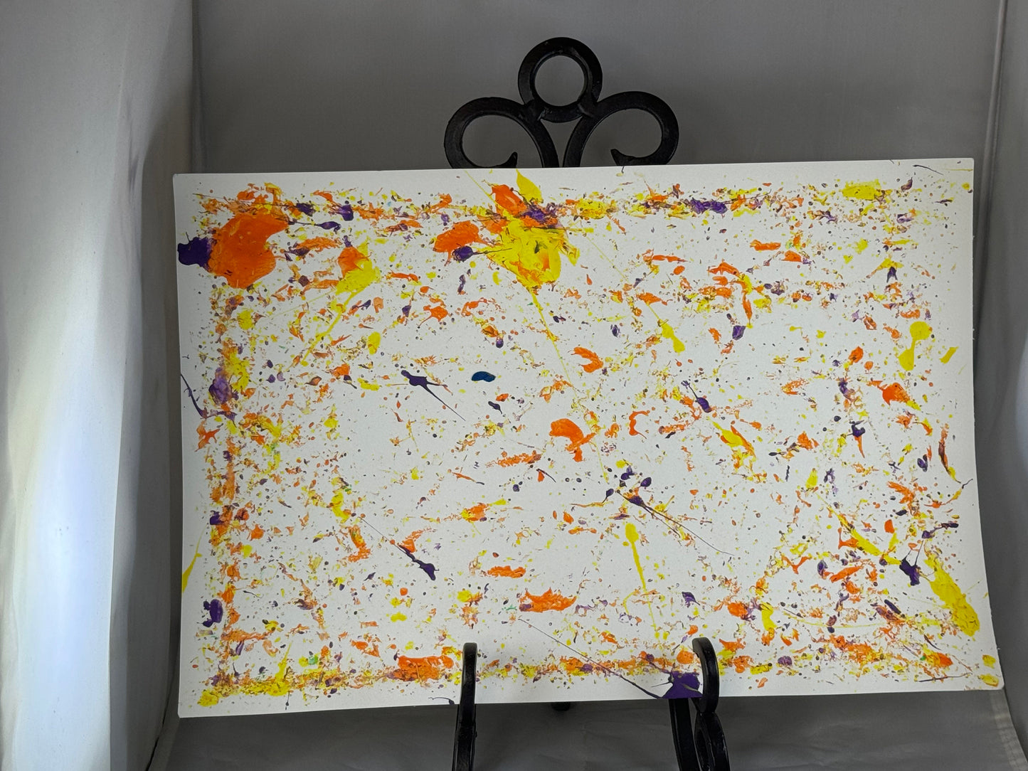 Kid art for sale to help those in need. Pictured "Paint Tag" by Zane M. (Art Paper, 14.5" x 10")
