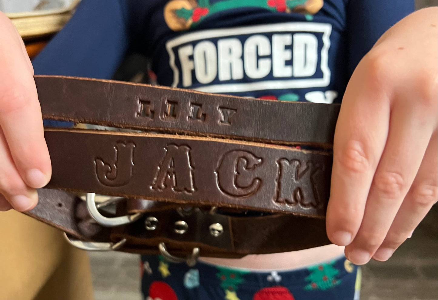 Two leather dog collars made by second grader Zane
