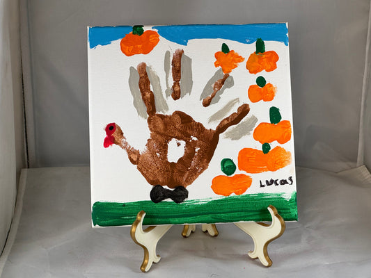 Kid art for sale to help those in need. Pictured "Hand Turkey" by Lucas, Cub Scout Pack 684 (Canvas, 8" x 8")