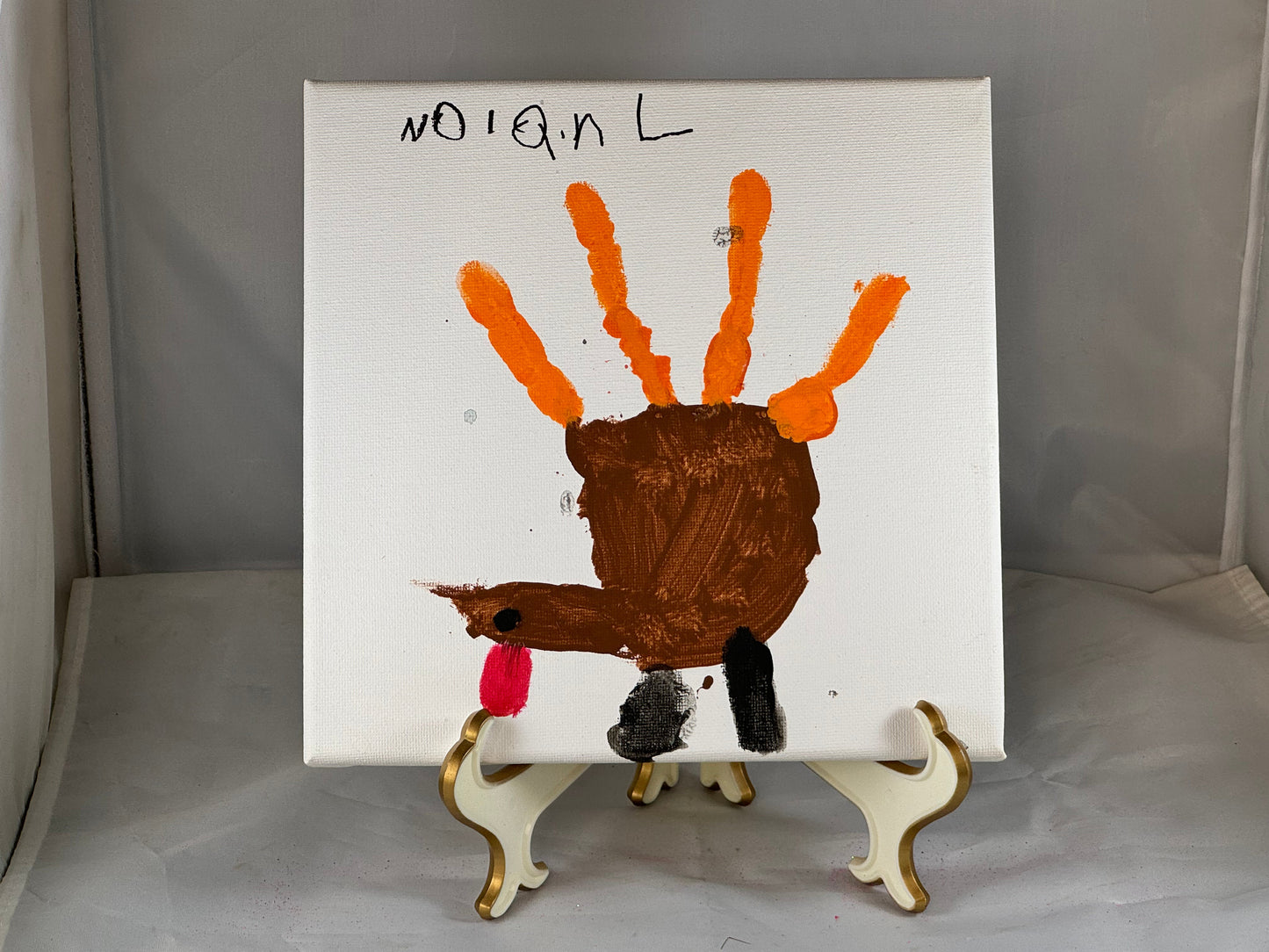 Kid art for sale to help those in need. Pictured "Hand Turkey" by Nolan L., Cub Scout Pack 684 (Canvas, 8" x 8")