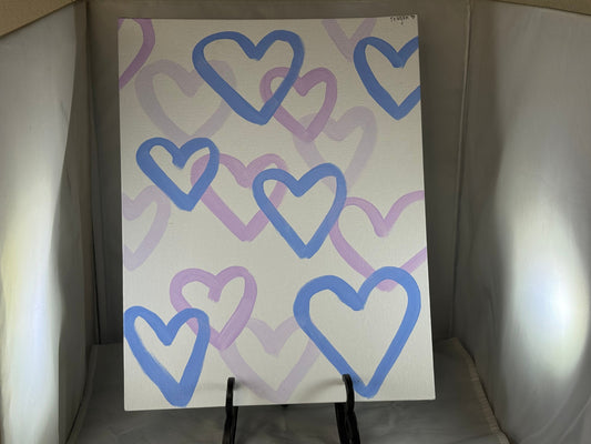 Kid art for sale to help those in need. Pictured "Heart Party" by Teagan L. (Canvas Panel, 14" x 11")